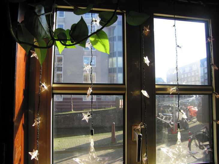 Window in canal-side pub in Amsterdam