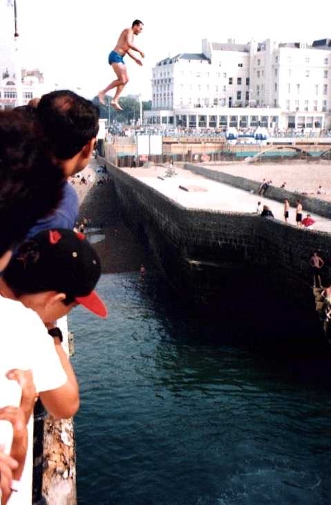 Jumping off the pier at Brighton, Sussex