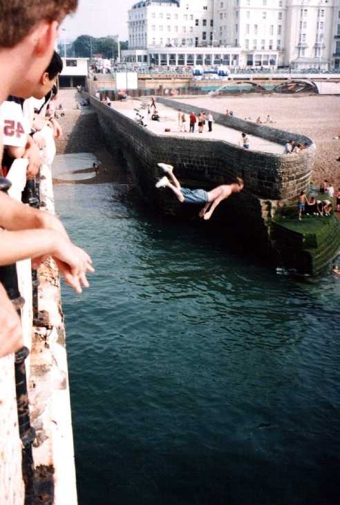 Diving from the pier, Brighton, Sussex