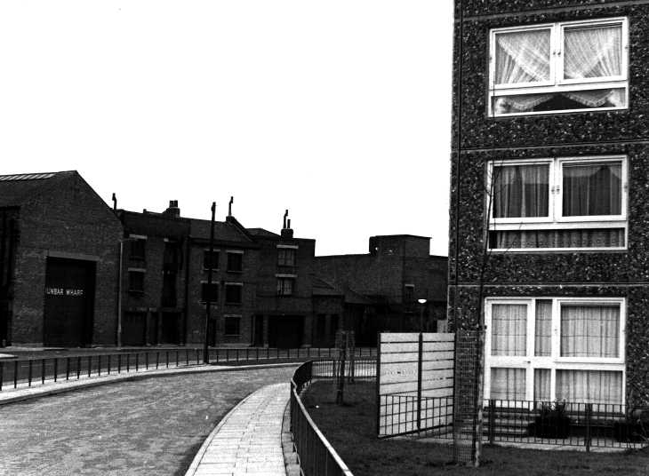 Black & white photograph. Old & new on east London estate