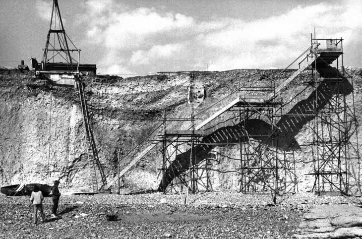 Black & white photograph. Shadows on white cliffs