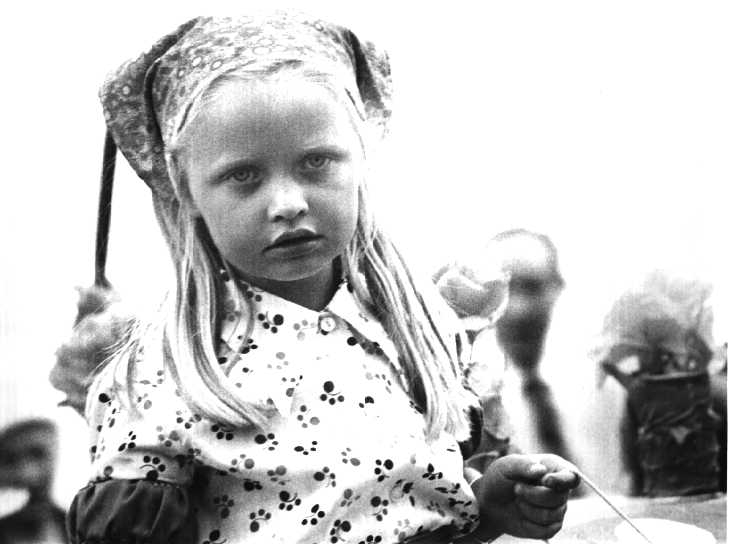 Black & white photograph. Girl in parade