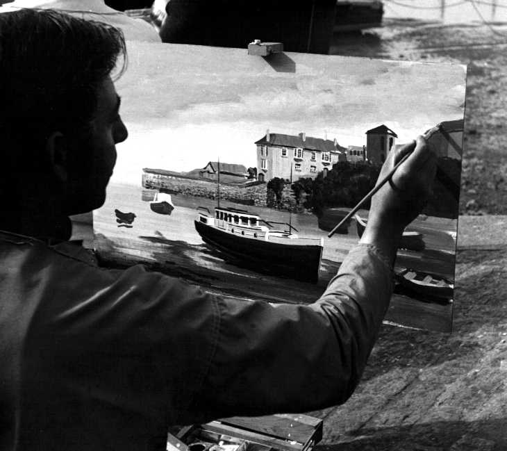 Black and white photo of seaside artist