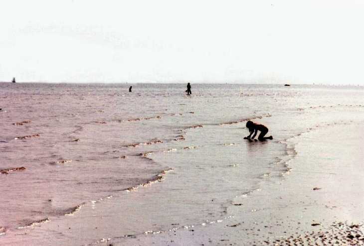 Girl, Worthing beach at low tide, Sussex