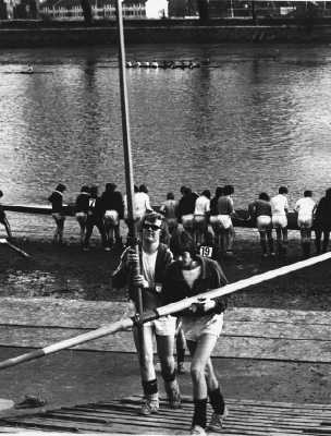 Rowers return bearing oars