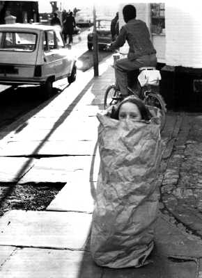 Girl peeping from bag