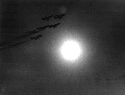 Jet planes pass the sun