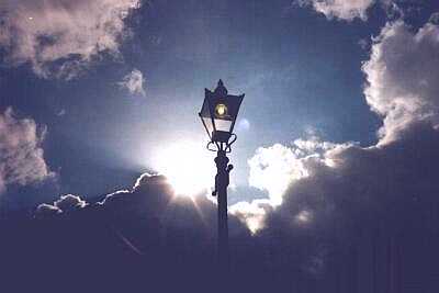 Alexandra Palace, North London, street lamp, sun, and stormy sky
