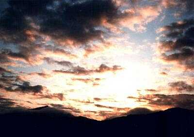 The sun rising over Snowdon